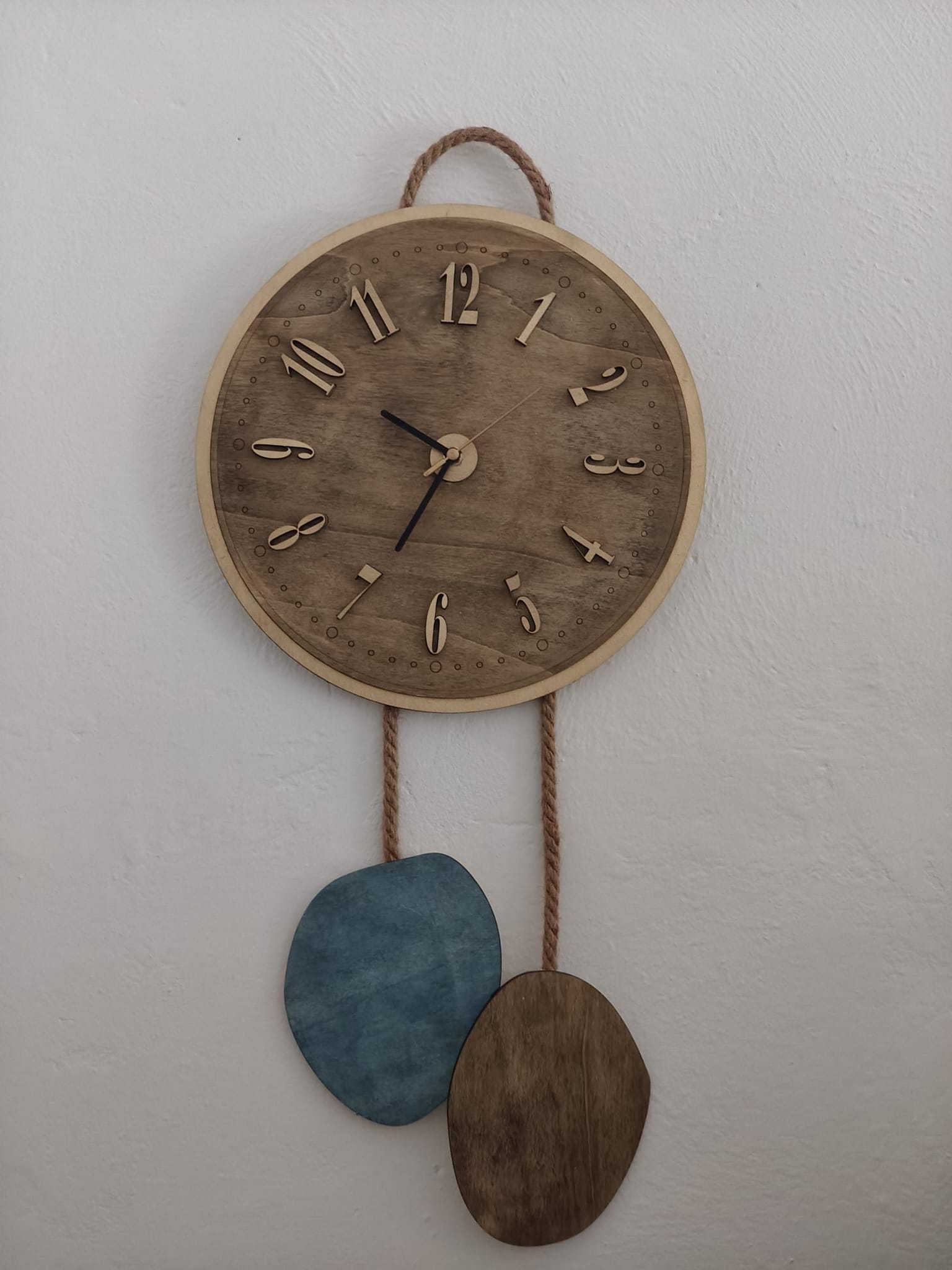 Wooden pendulum-shaped wall clock WhatsApp Image 2025 09 14 at 20.41.39 Wooden pendulum-shaped wall clock